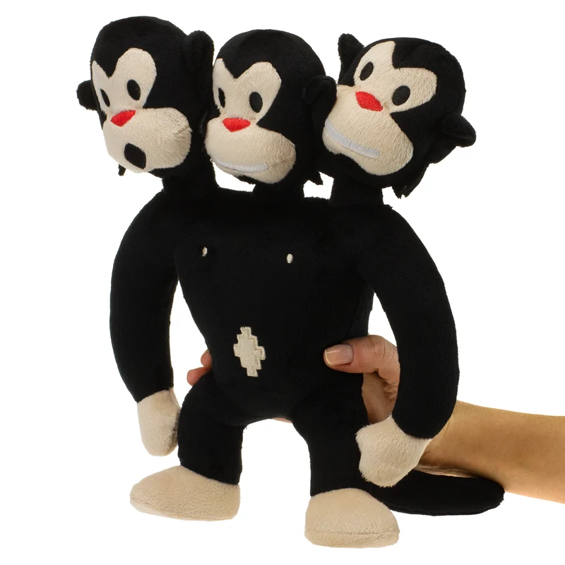 Singe à trois têtes en peluche